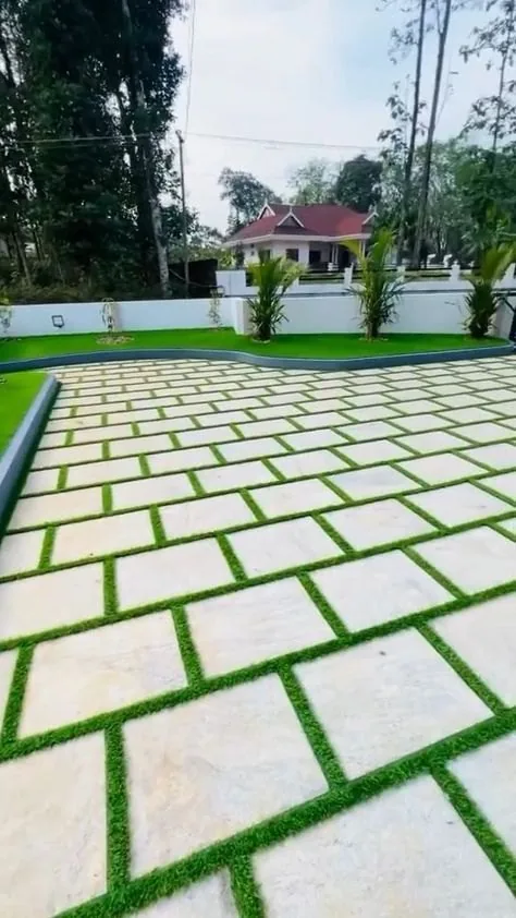 Pavers with grass joints — Square pavers with grass between the joints.